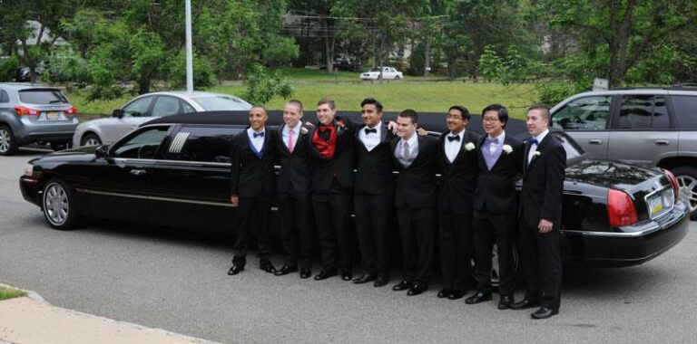 Prom boys standing in from of metrowest limousine's luxury prom limousine