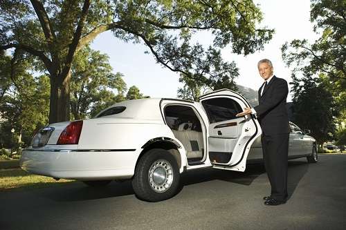 limousine for rent in florida, Chauffeur inviting to the luxury car provided by JM Limos
