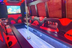 Black party bus with red and black interior in South Florida